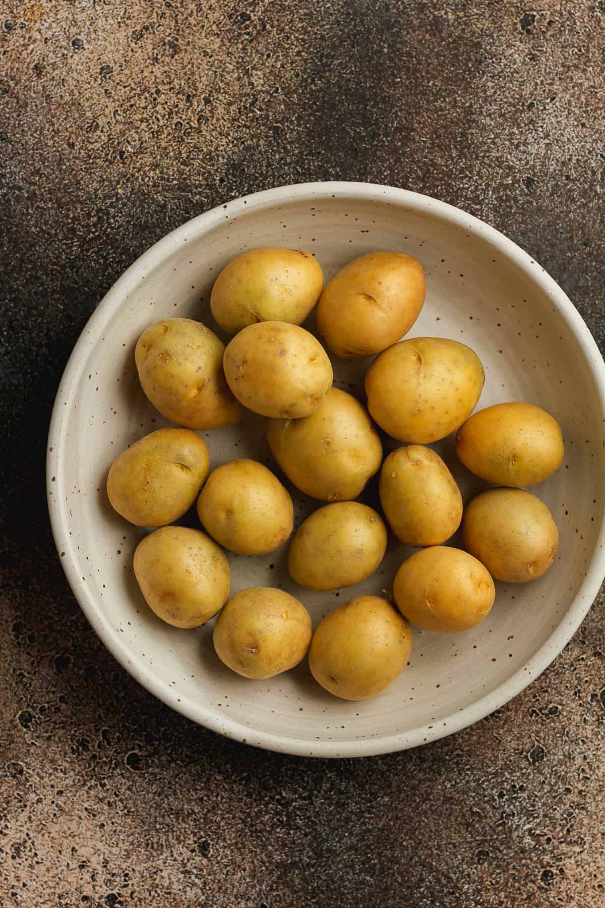 A bowl of yellow baby potatoes.