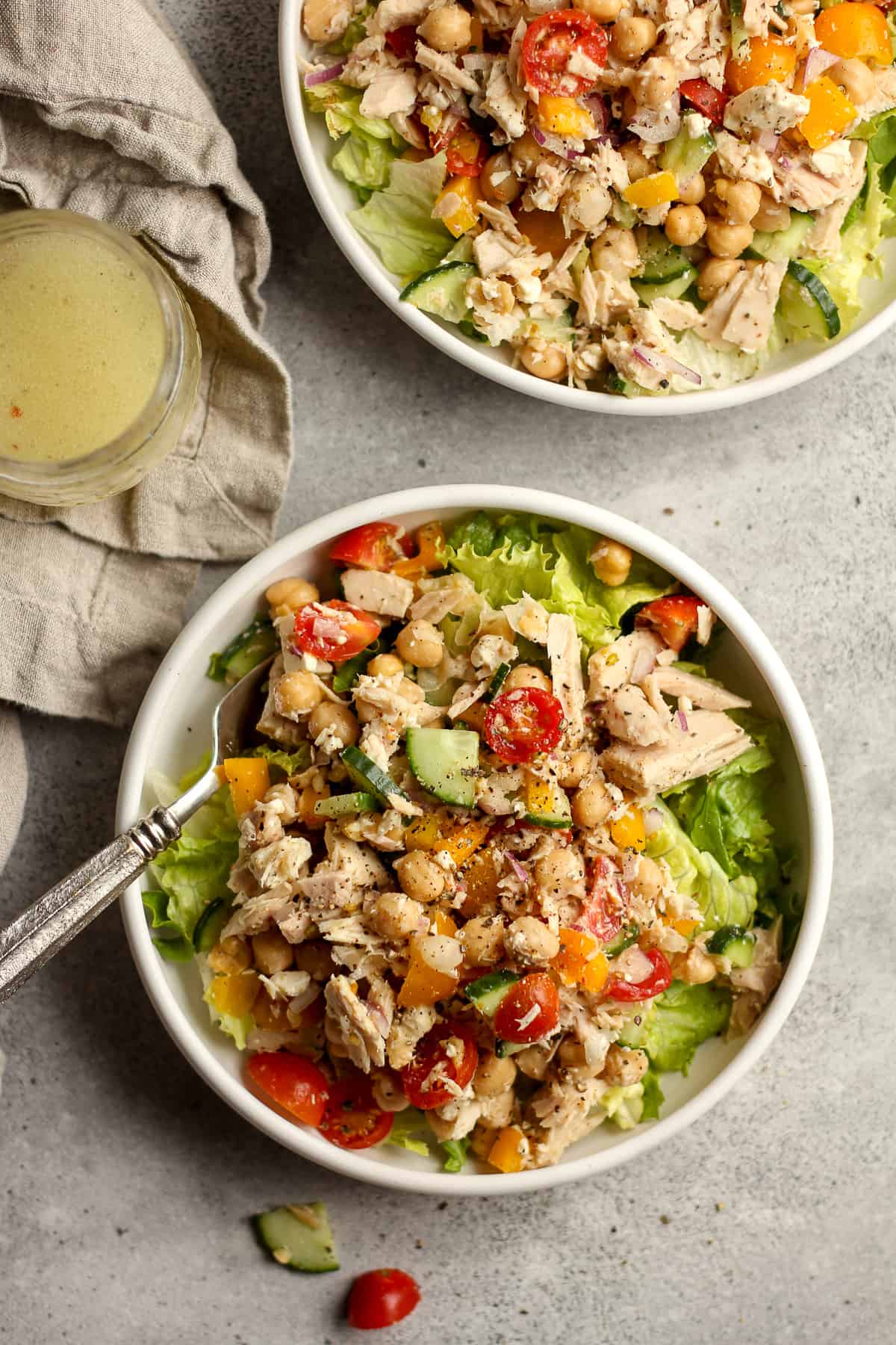 Two bowls of healthy chickpea tuna salad with lettuce.