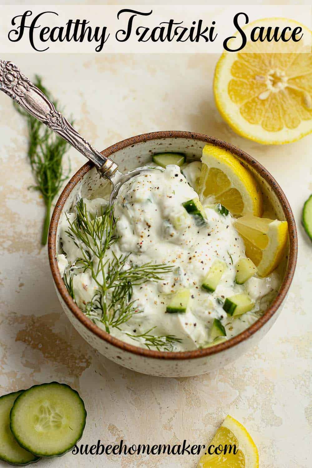 A bowl of healthy Tzatziki Sauce with fresh lemon and mint.