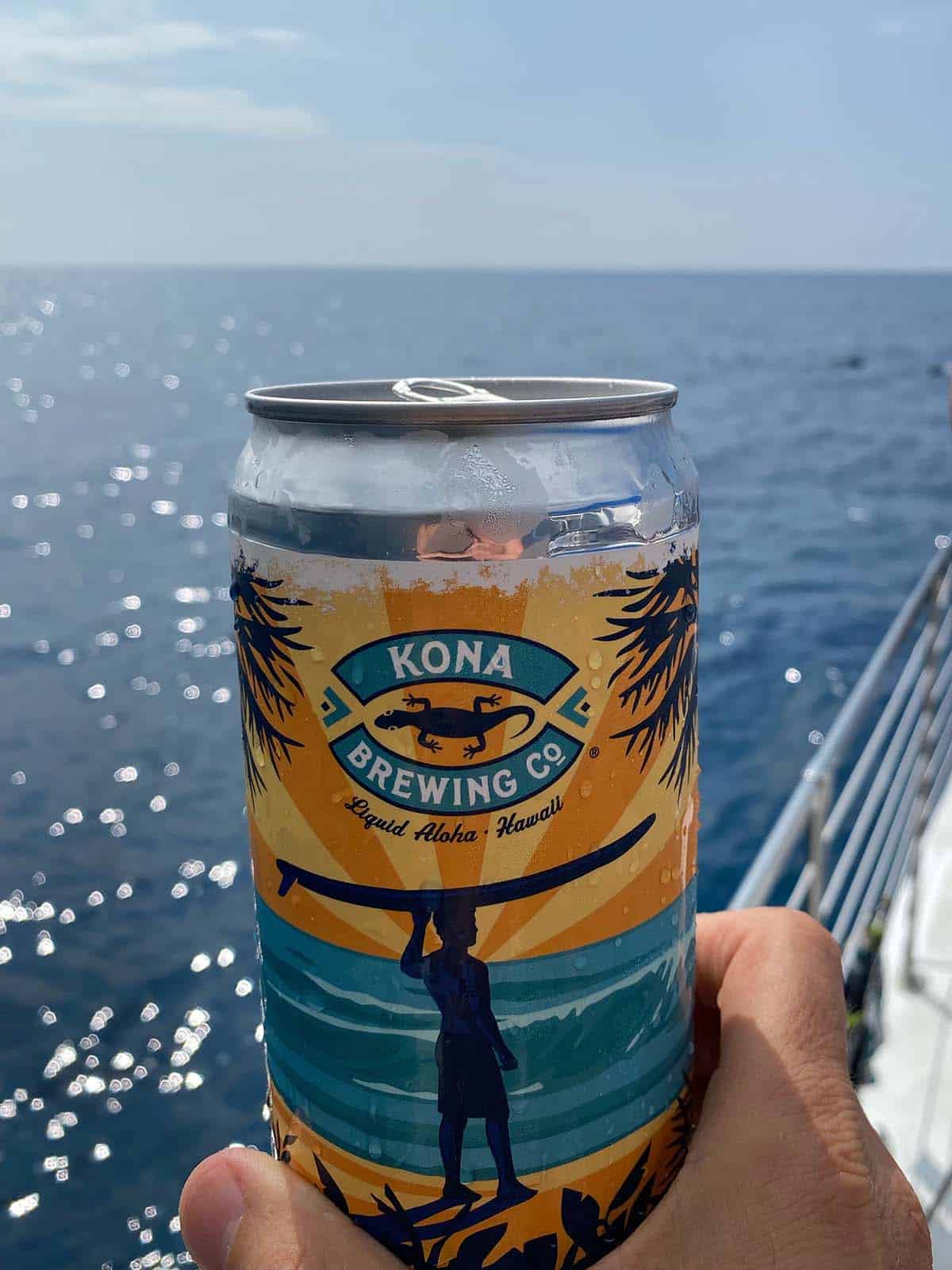 A can of Kona brewing above the ocean.