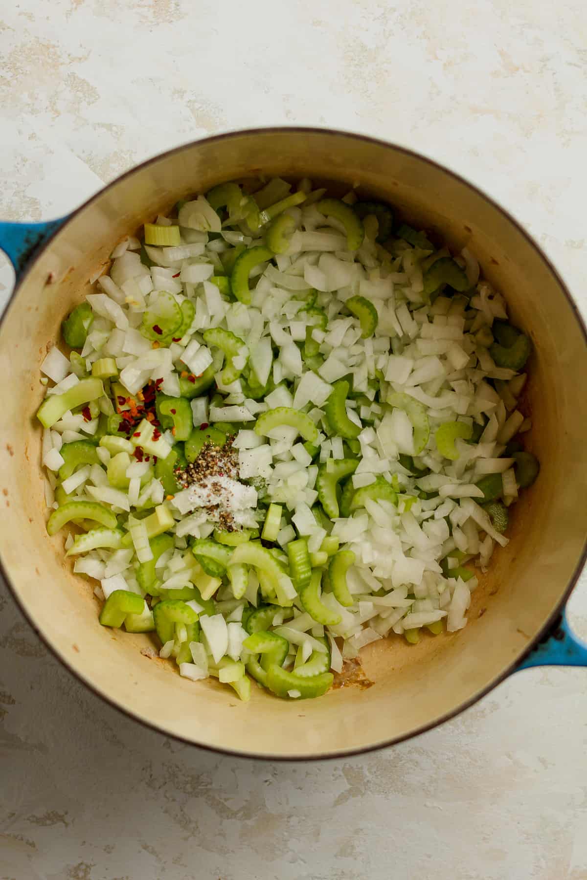 The onions and celery with the seasonings on top.