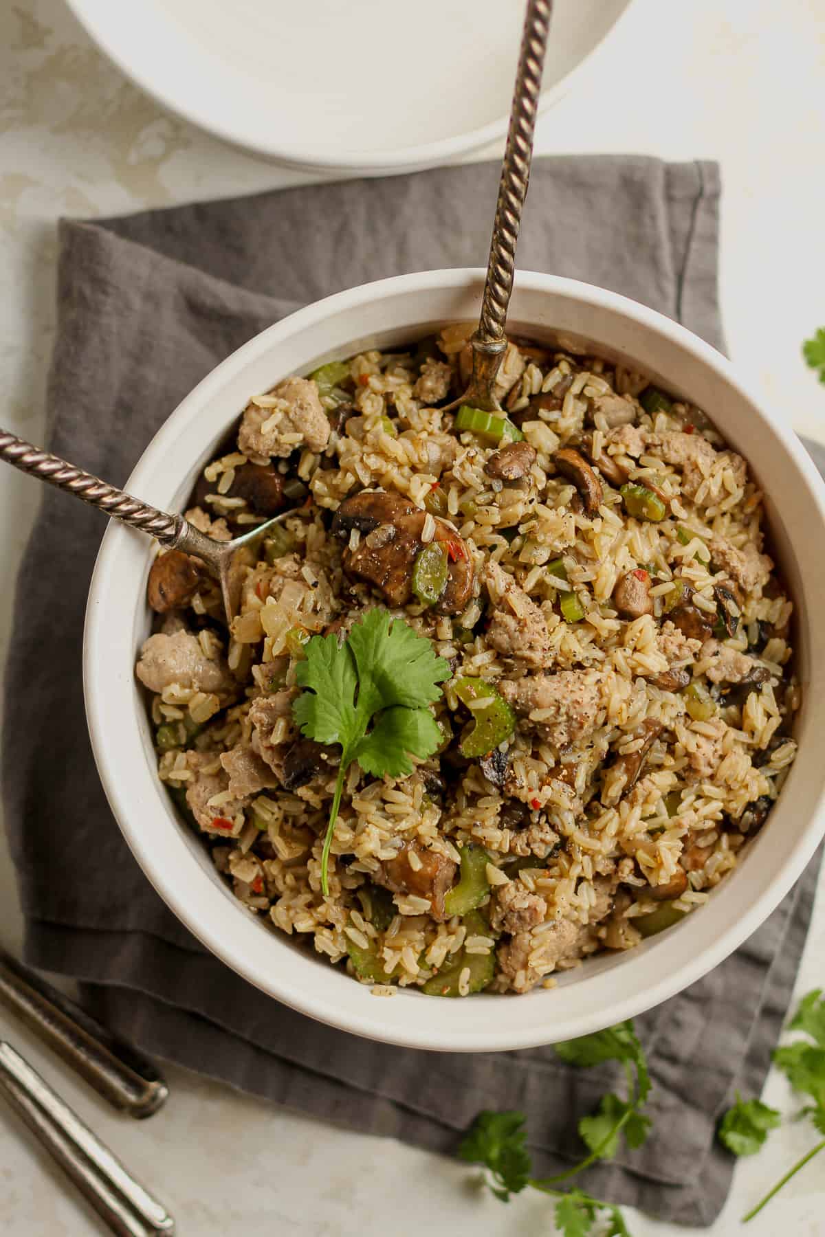 Overhead shot of a round bowl of rice dressing with mushrooms.