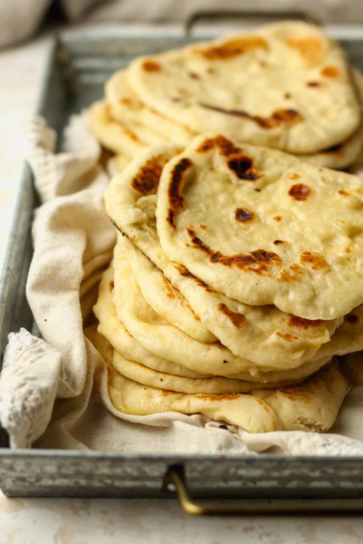 Side view of stacked naan bread.