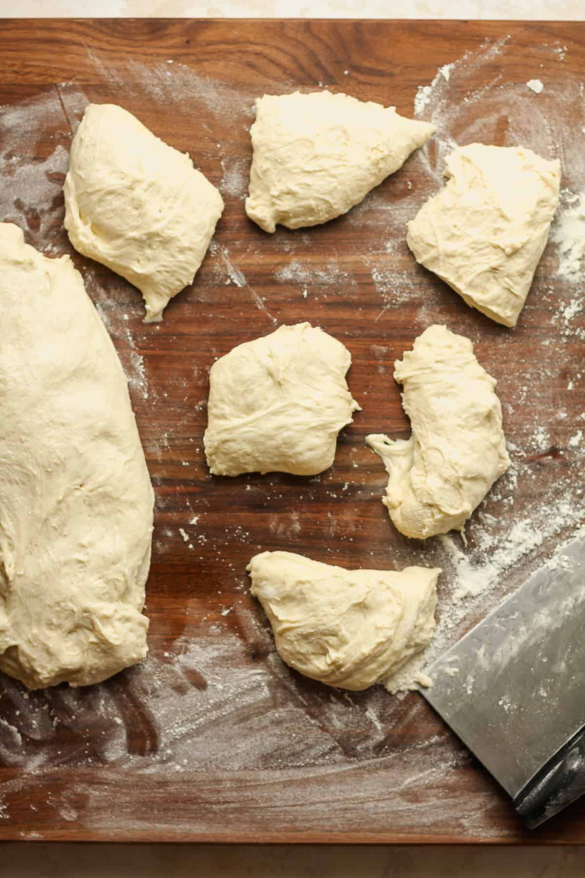 Several pieces of the naan ready to be rolled.