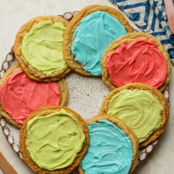 A plate of frosted sugar cookies.