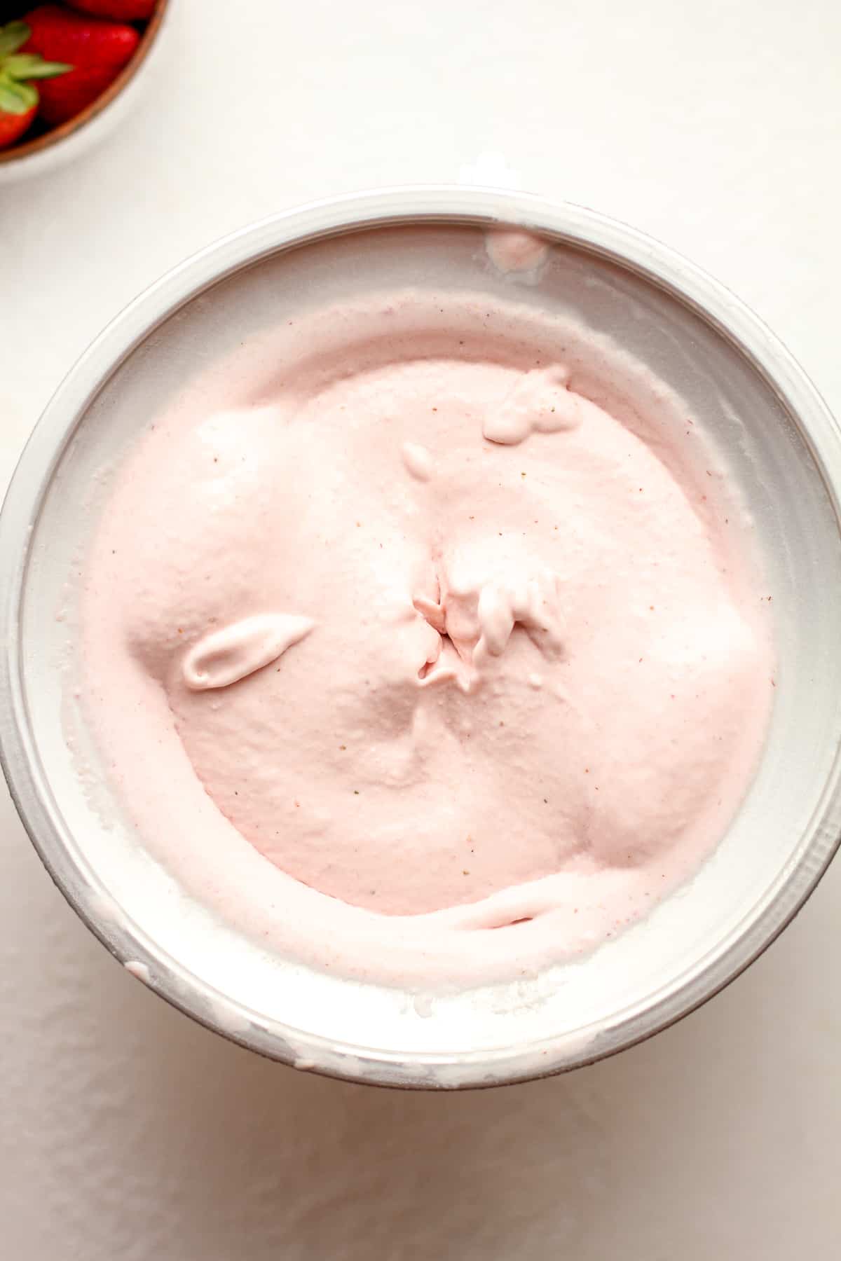 A KitchenAid attachment of homemade strawberry ice cream.