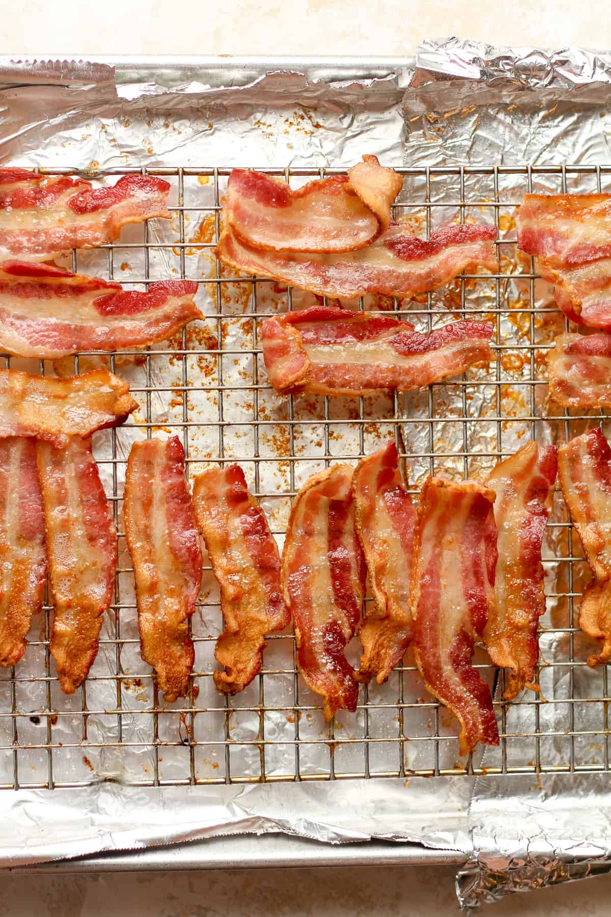 A pan of crispy bacon on a cooling rack.