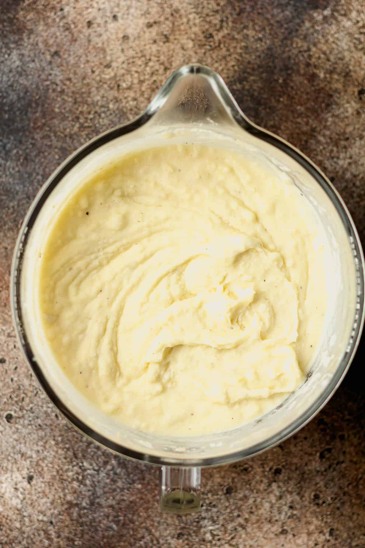 A mixer full of creamy mashed potatoes.