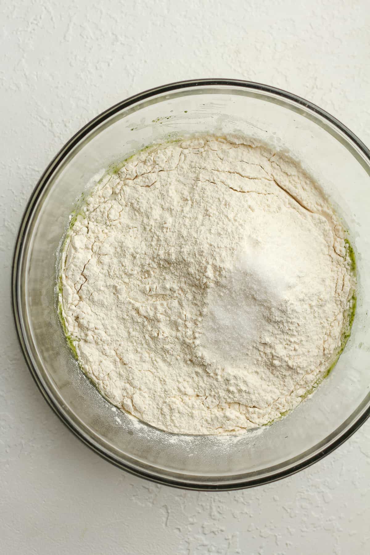 The sourdough mixture with flour and salt on top.