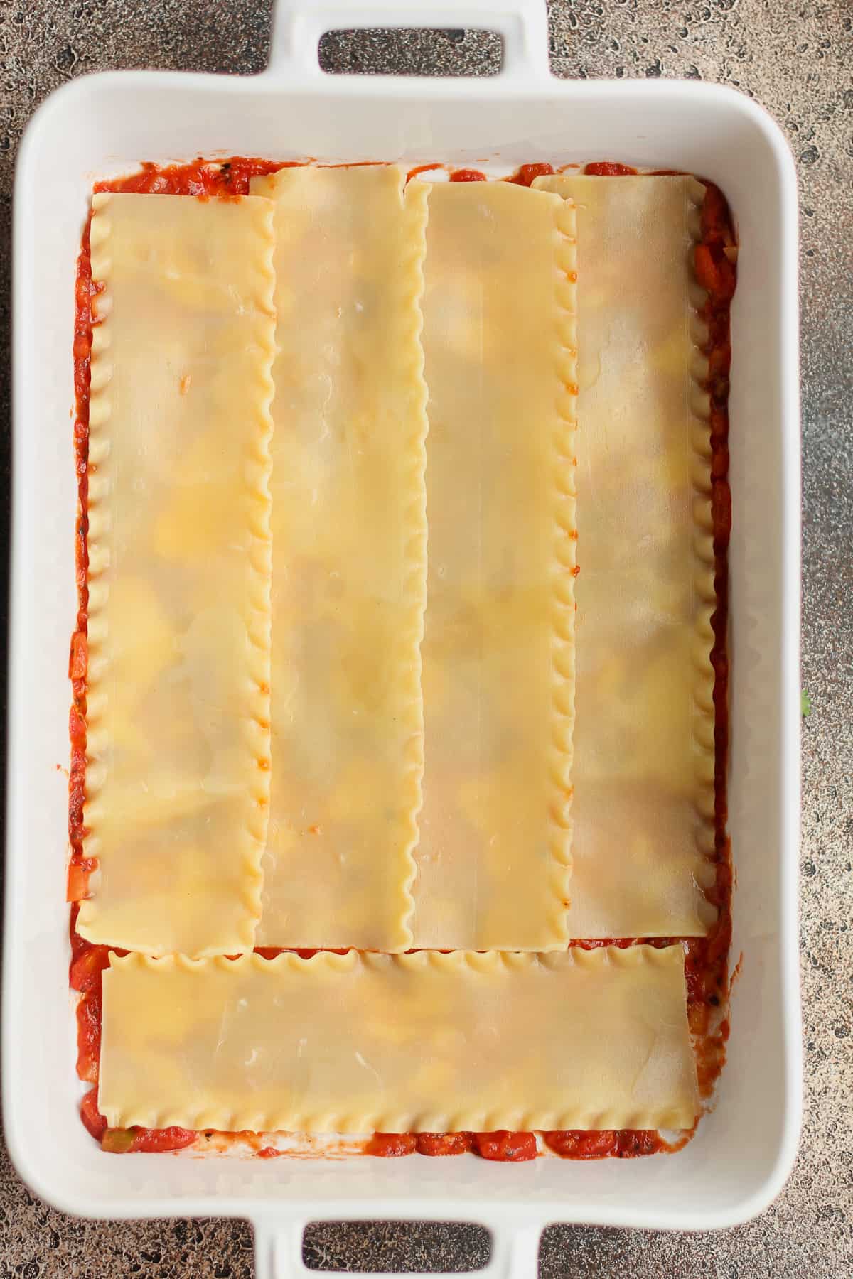 The casserole with the lasagna noodles on top.