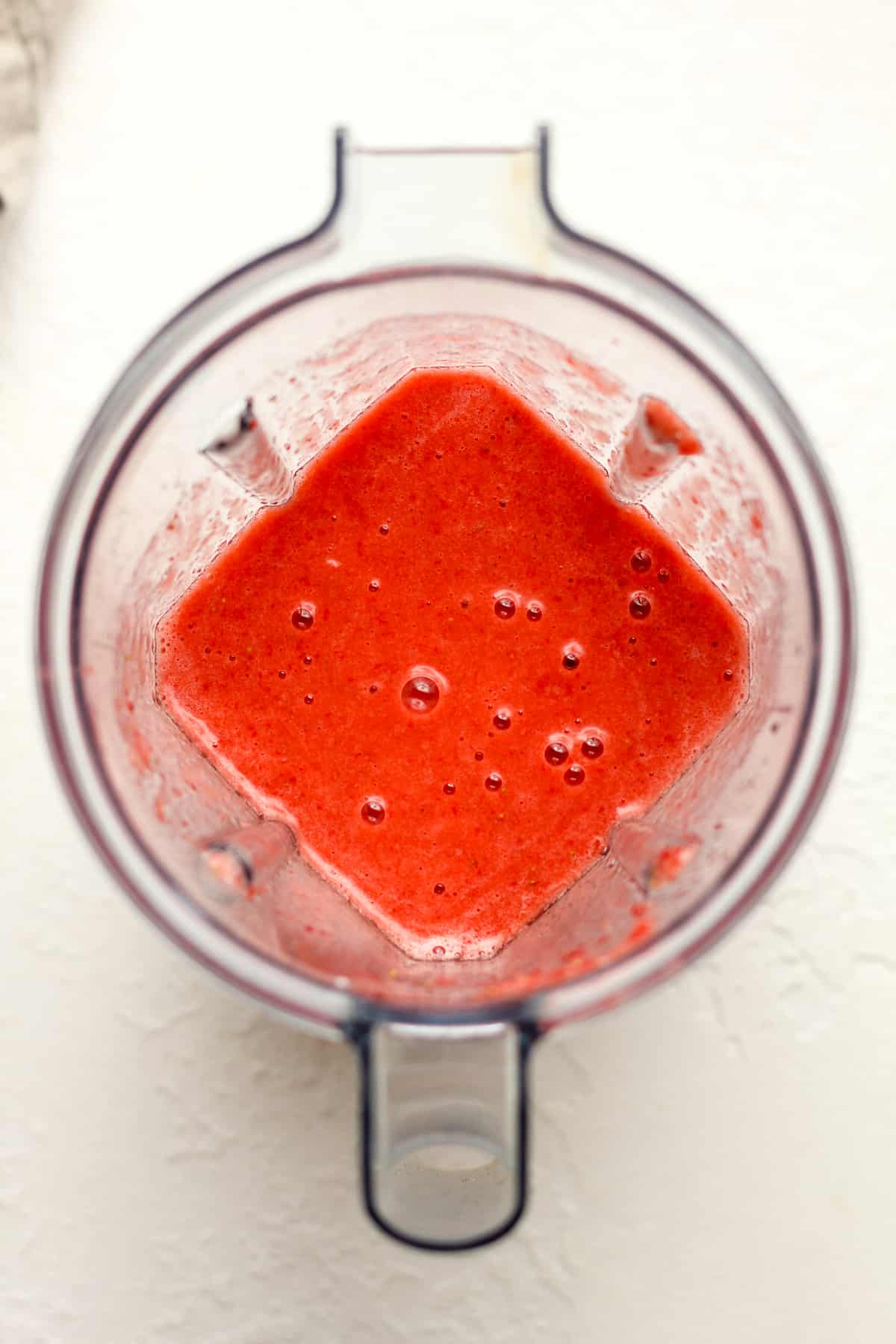 A blender of the pureed strawberries.