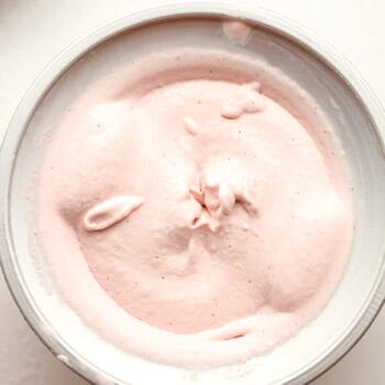 A KitchenAid attachment with creamy strawberry ice cream.