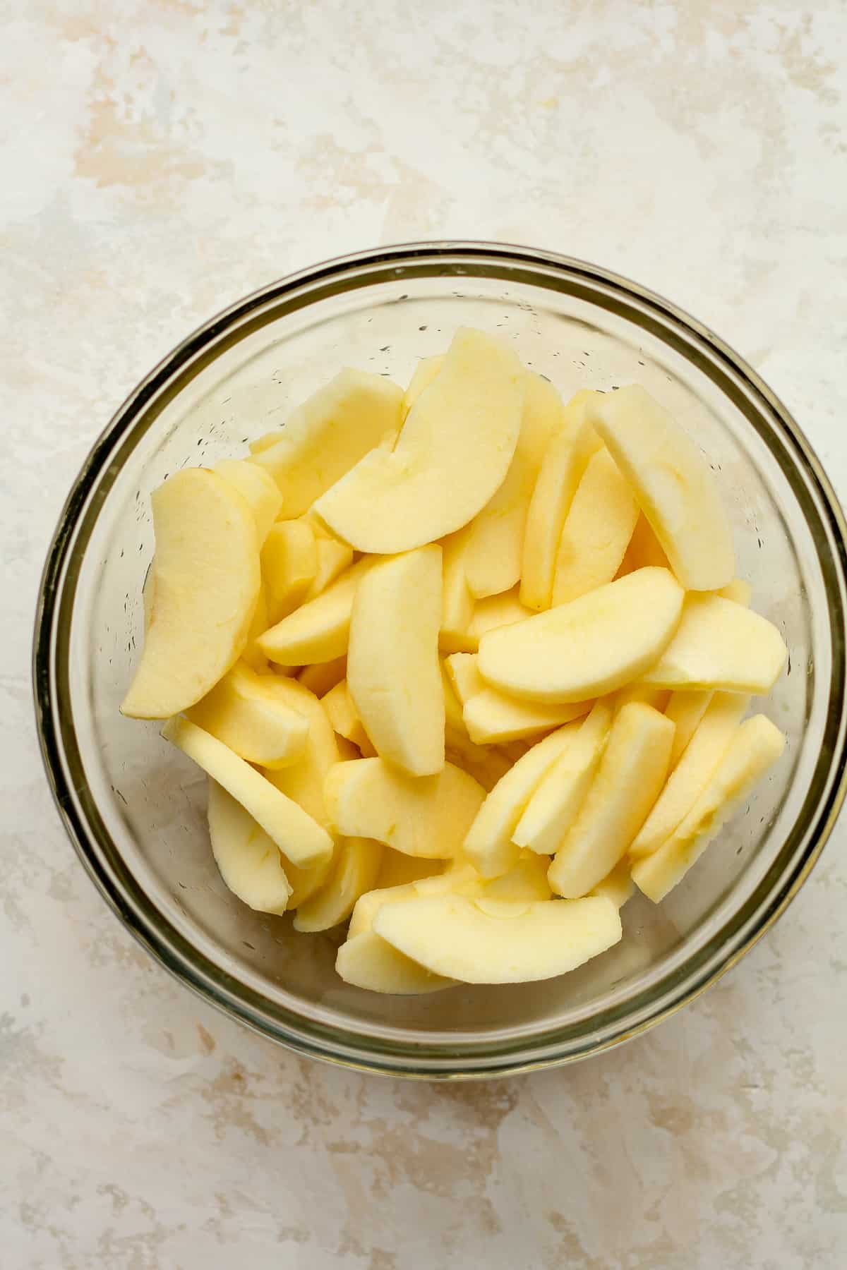 A bowl of sliced apples.