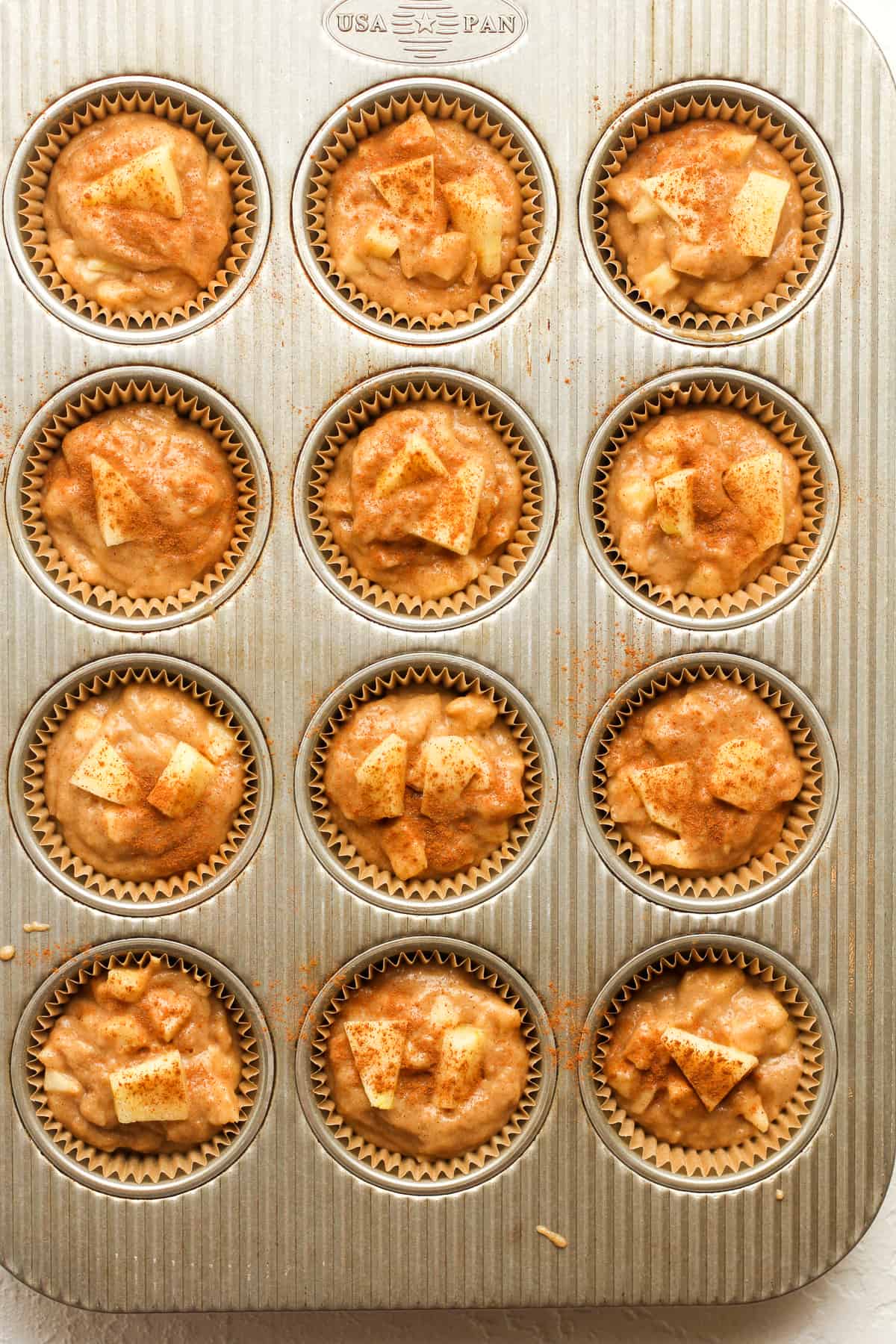 A muffin tin of the unbaked muffin batter.