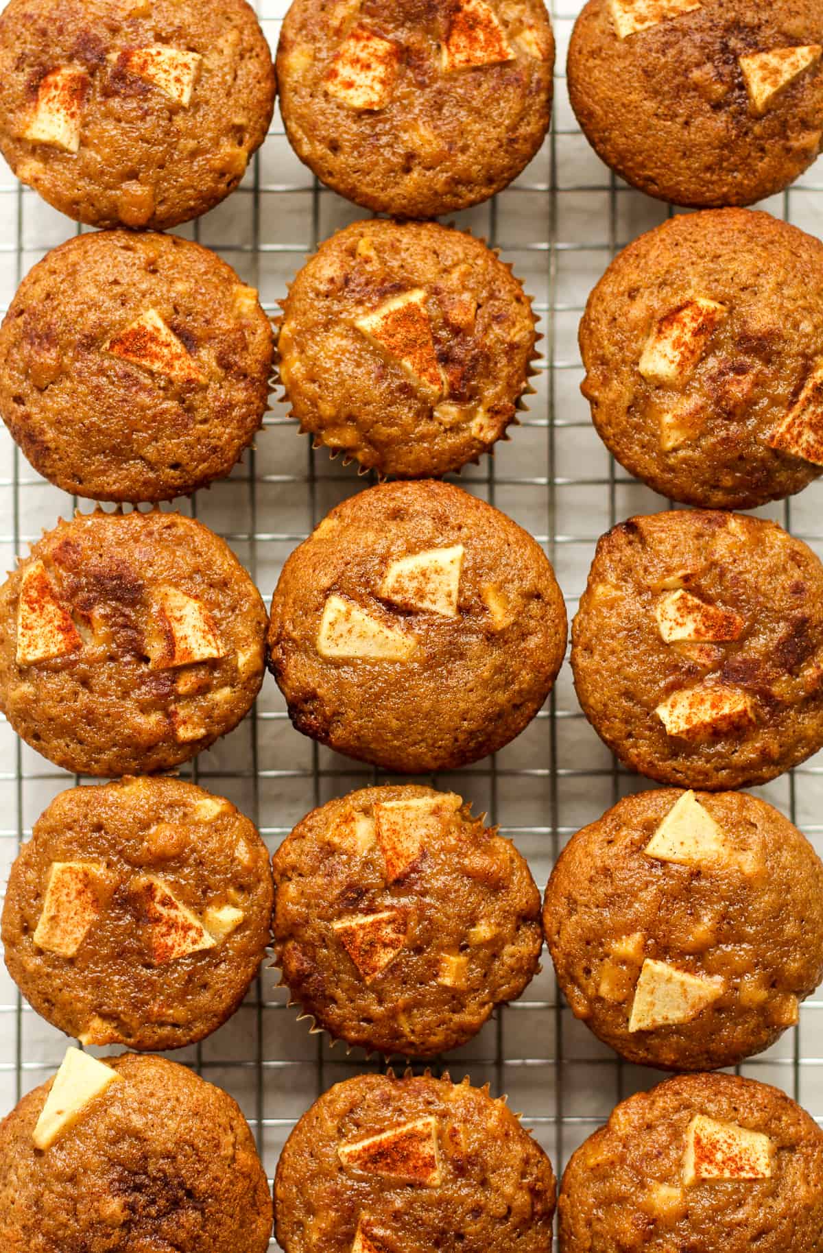 A cooling rack of applesauce muffins.