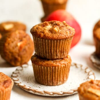 A plate of stacked applesauce cinnamon muffins.