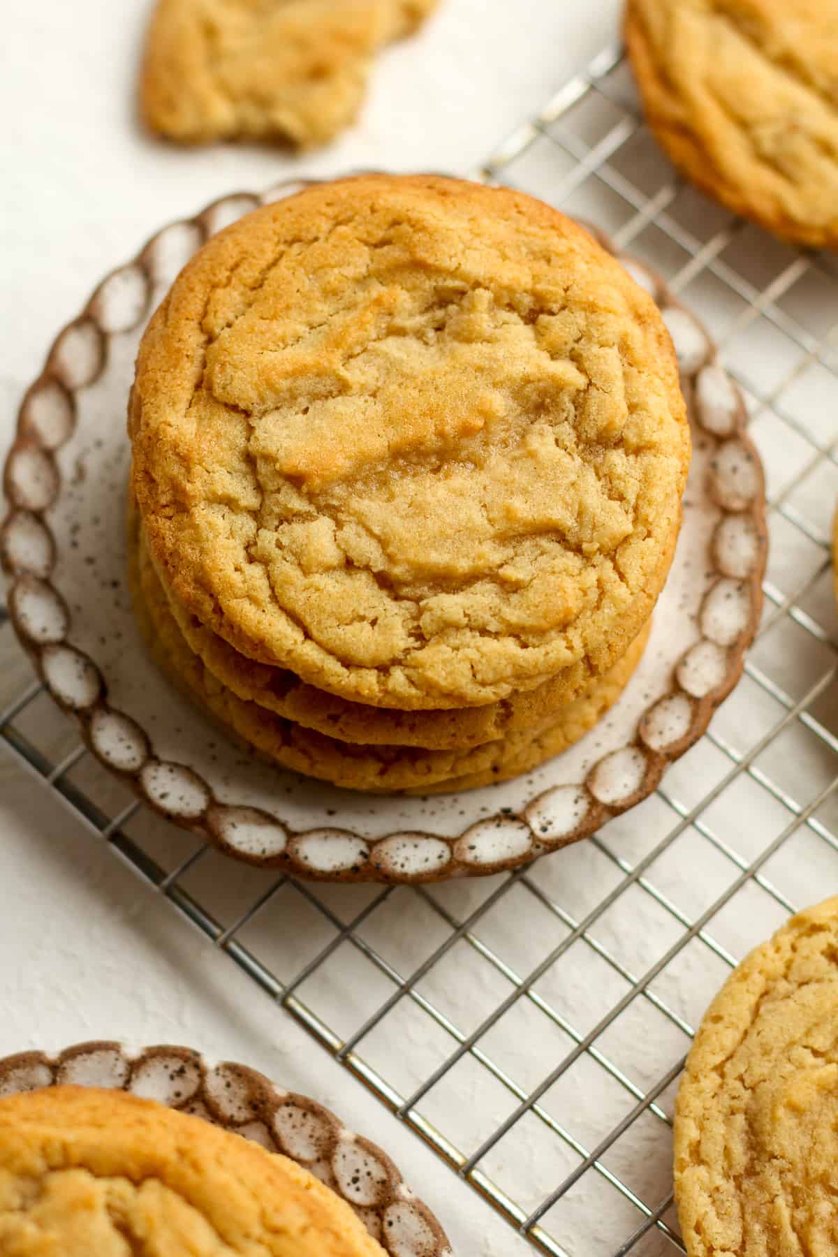 A stack of brown butter sugar cookies on a small plate.