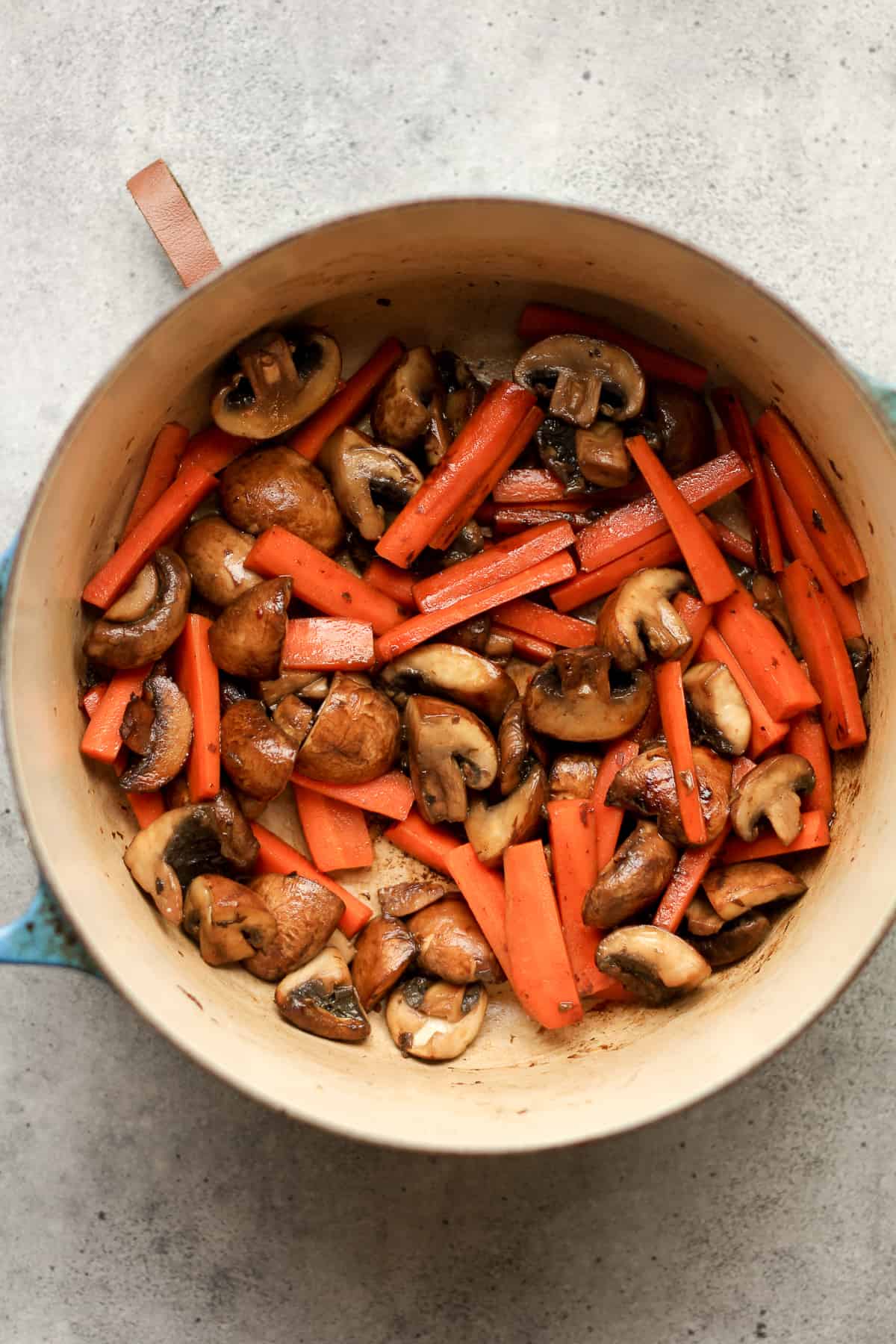 A pot of the sautéed mushrooms and carrots.