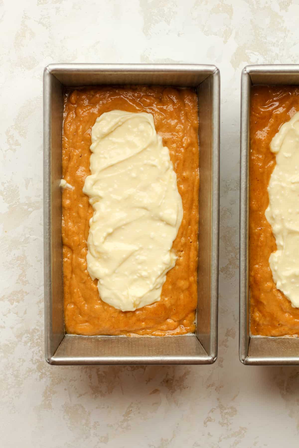 Pumpkin loaves showing the cream cheese layer.