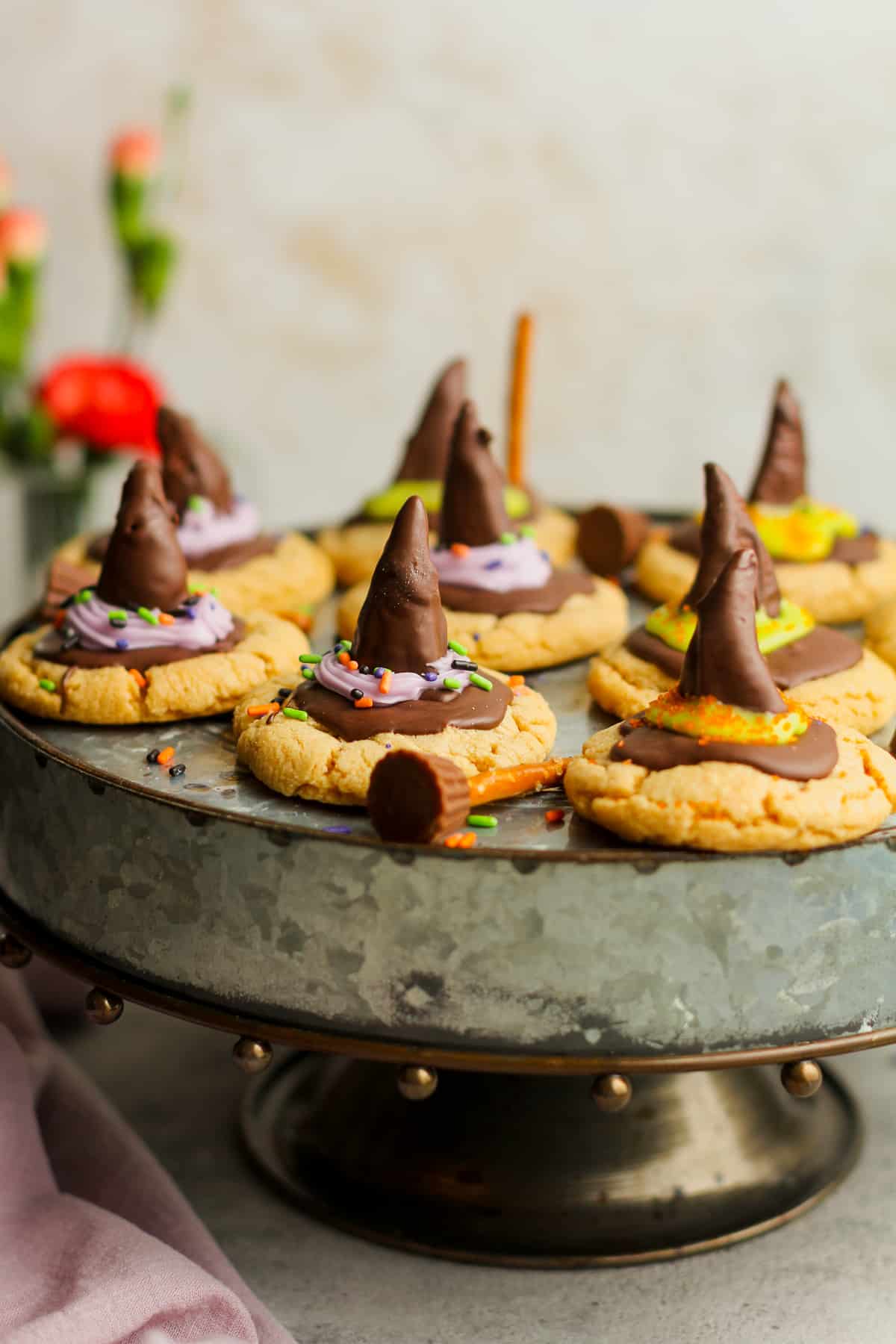 A cake platter of witch hat cookies with bugles.