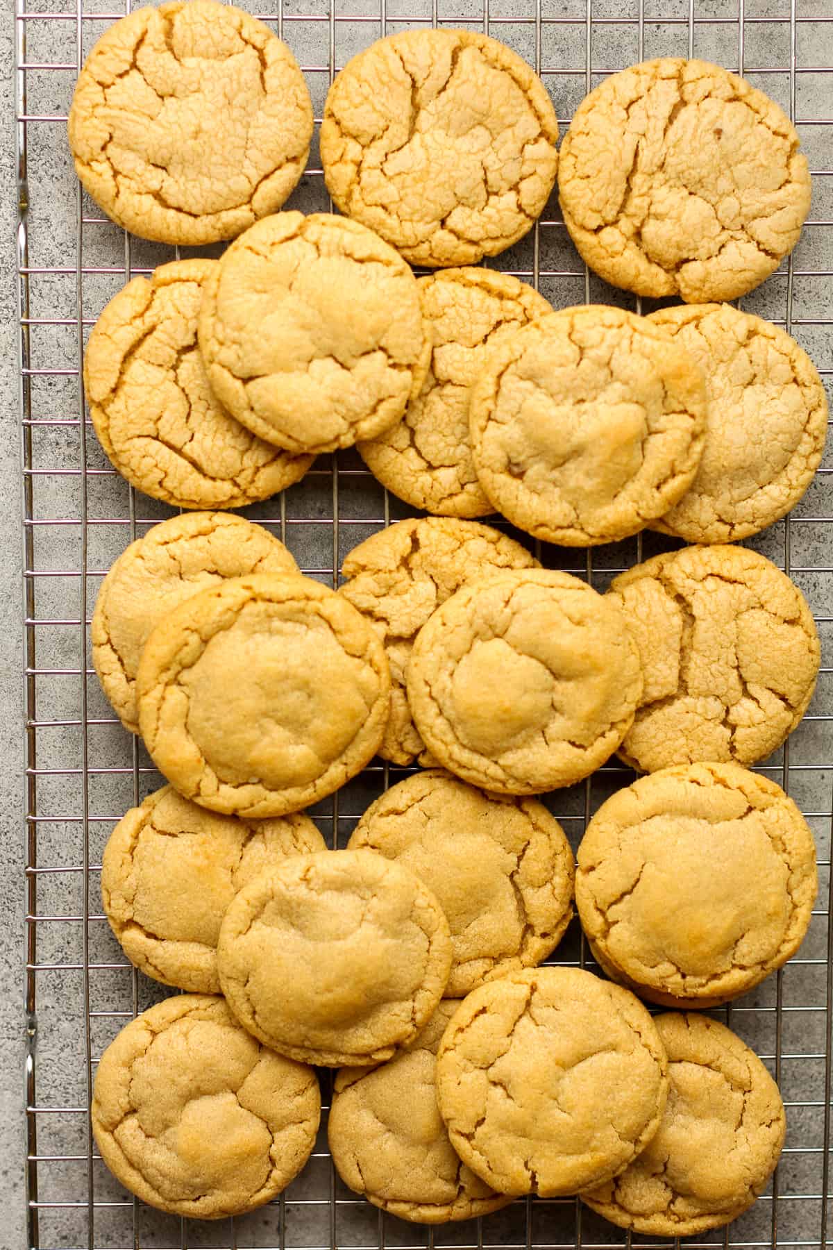 A wire rack of the peanut butter cookies.