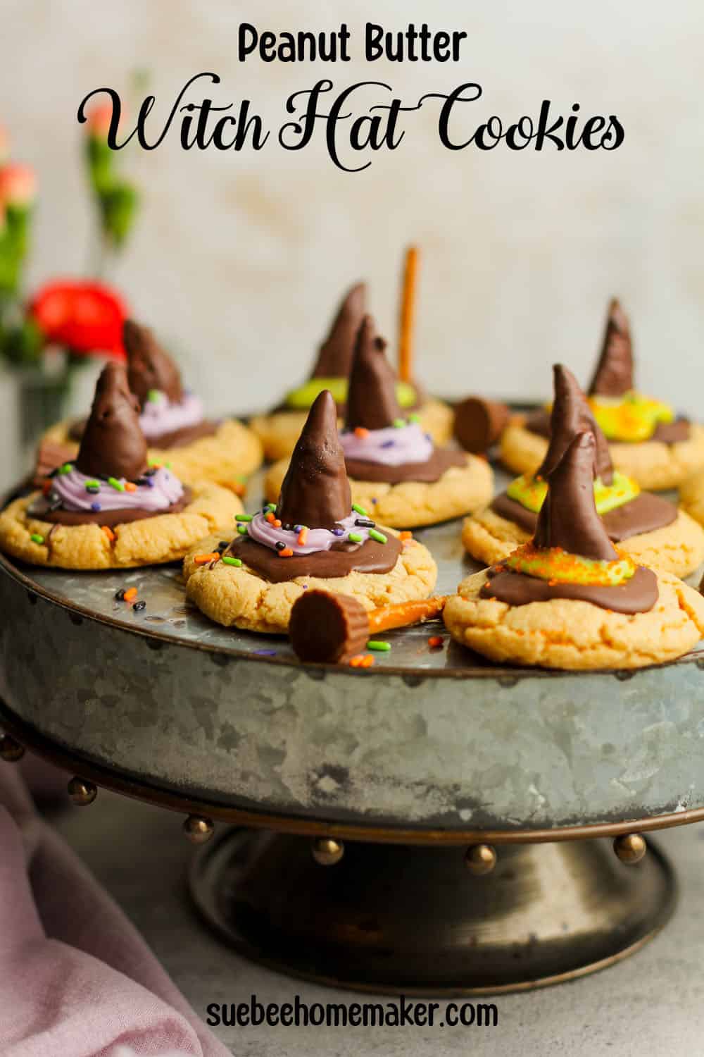 A silver tray of peanut butter witch hat cookies.