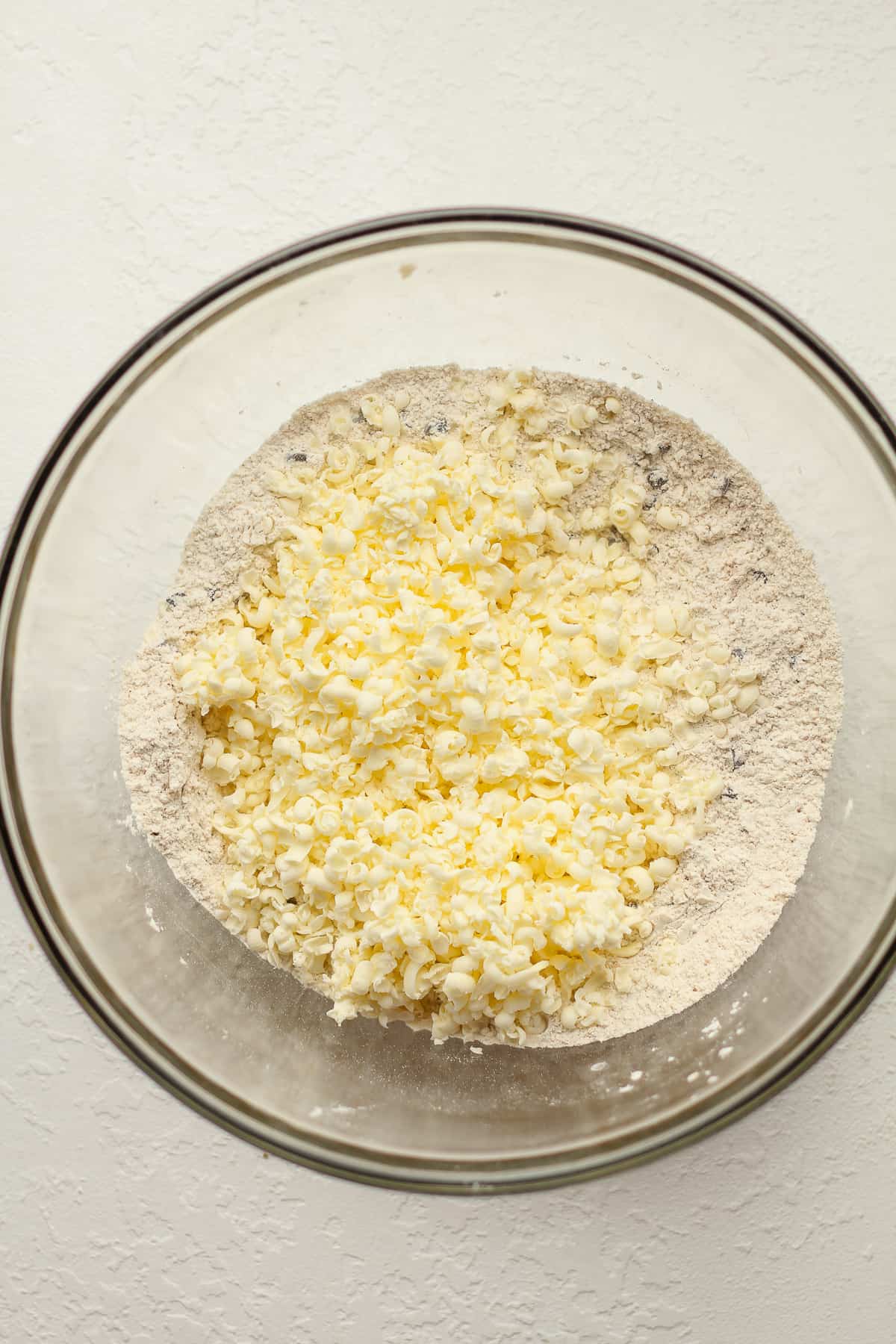 The dry scone ingredients with the grated butter on top.