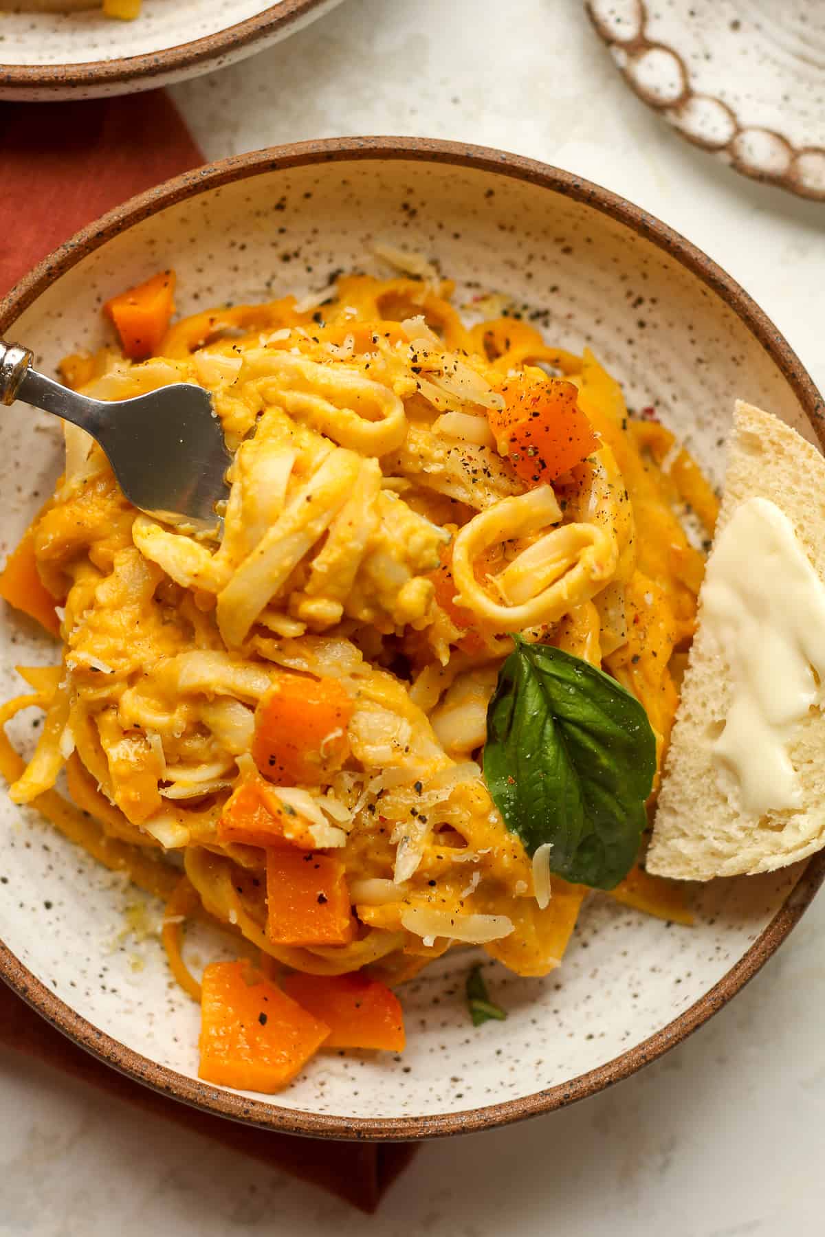 A bowl of creamy pasta with butternut squash.