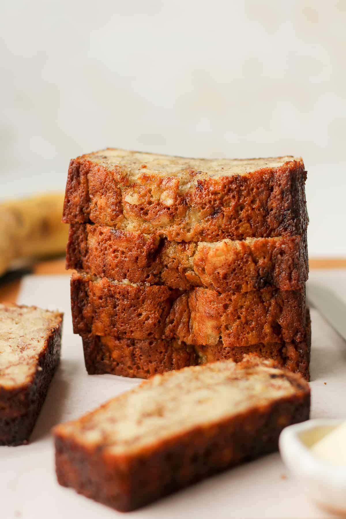 A stack of four slices of banana bread.