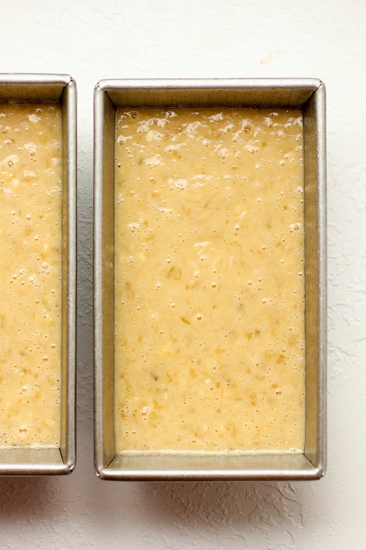 Two pans of the banana batter.