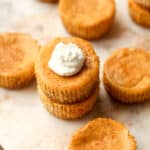 Pumpkin cheesecake bites on a tray.