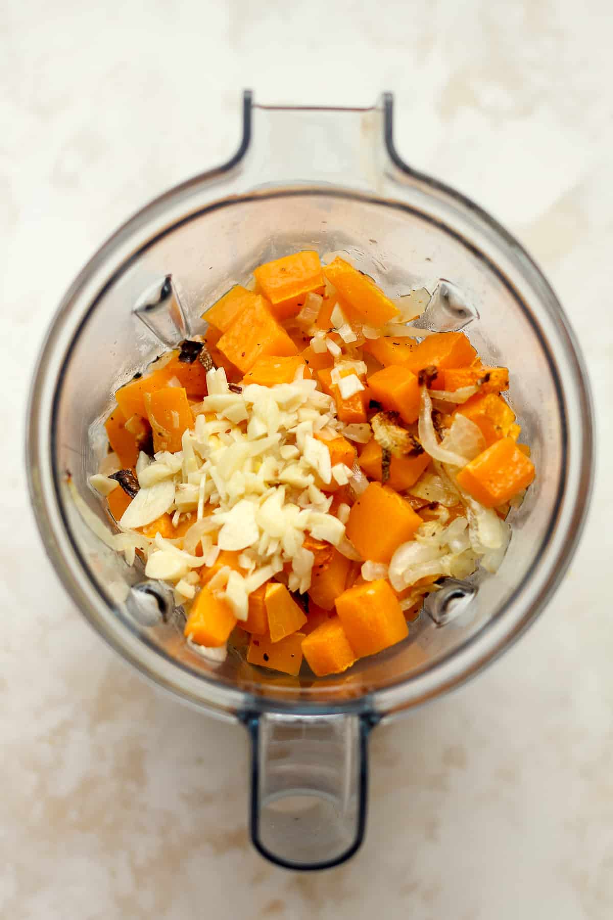 A blender of just roasted butternut squash, onions, and minced garlic.