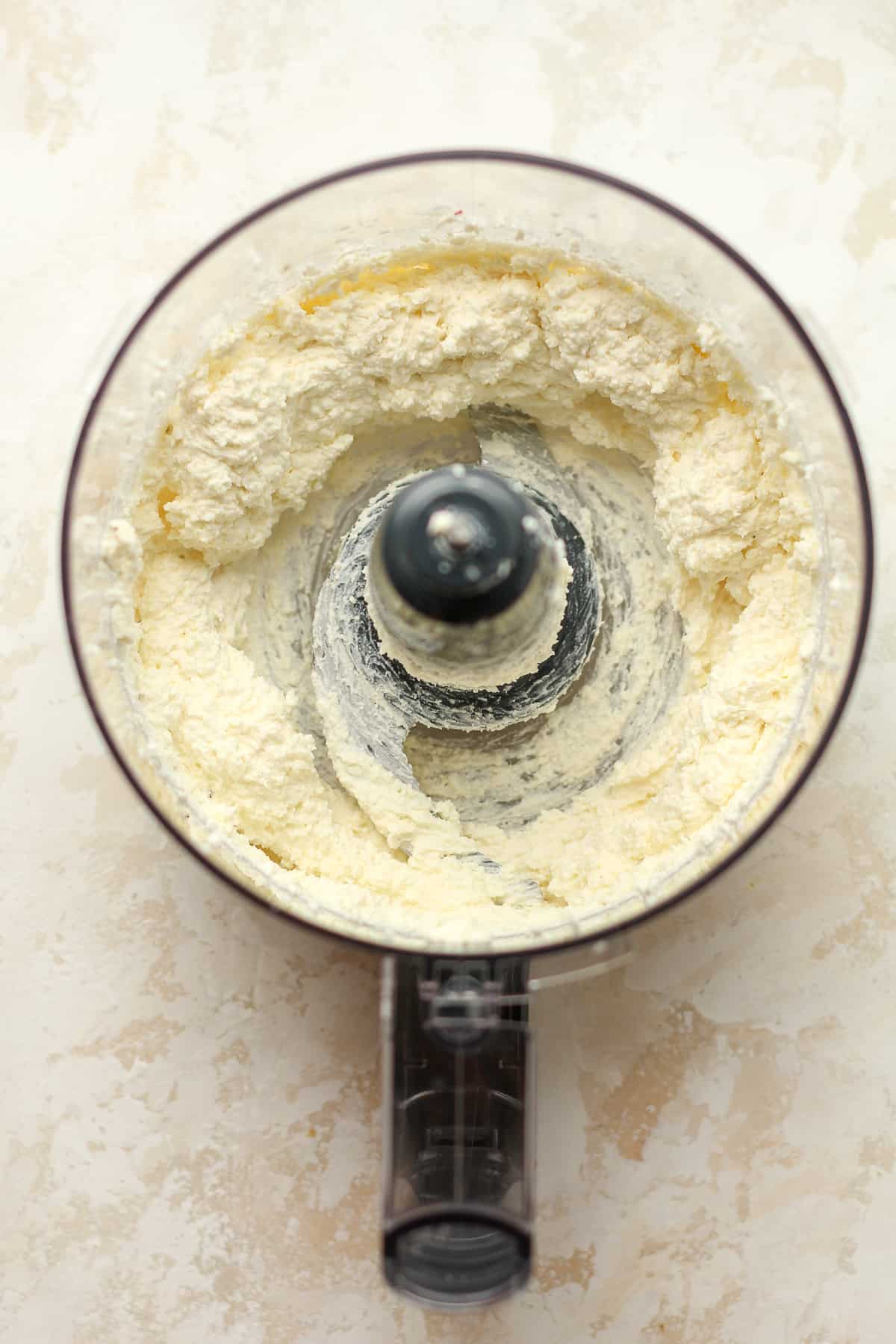 The food processor with whipped feta and cream cheese.