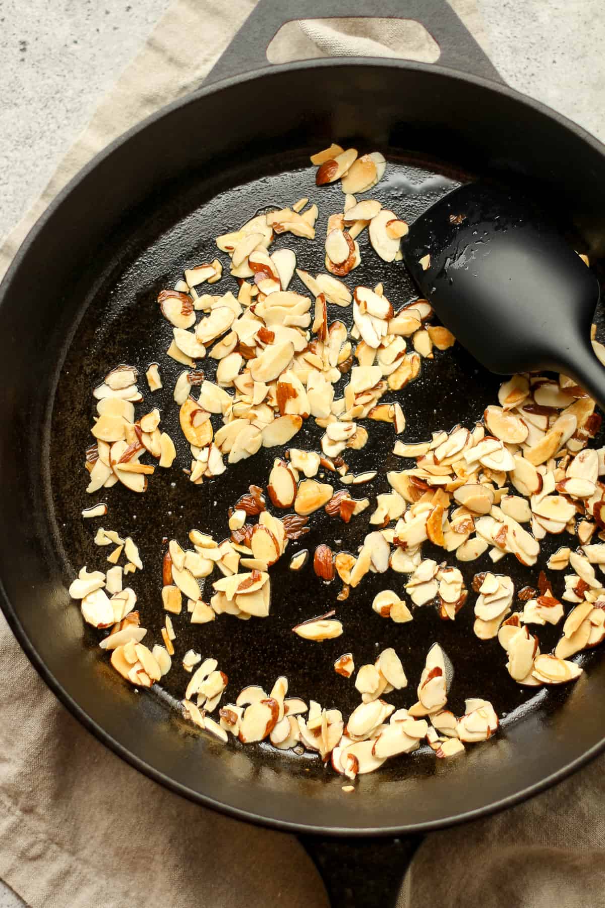 A skillet of sautéed almonds.