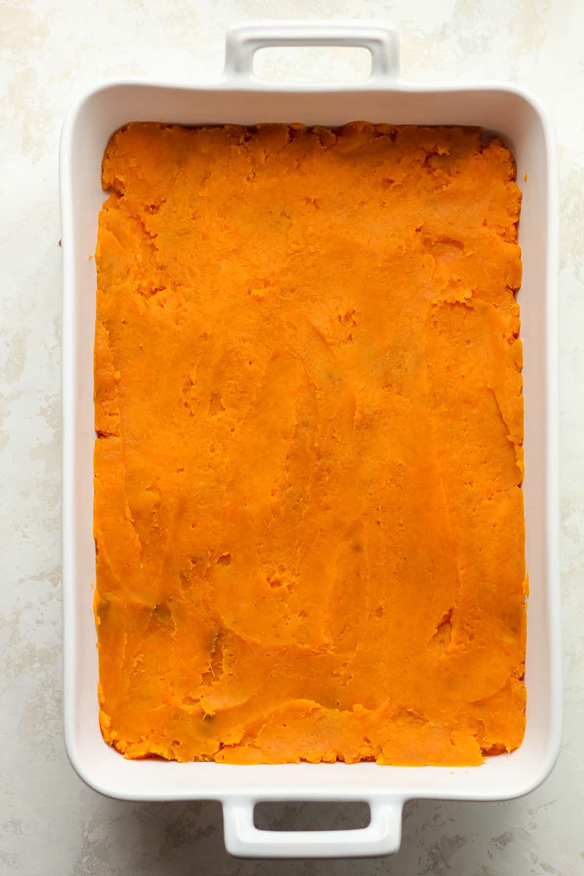 A casserole of the sweet potatoes on the bottom.