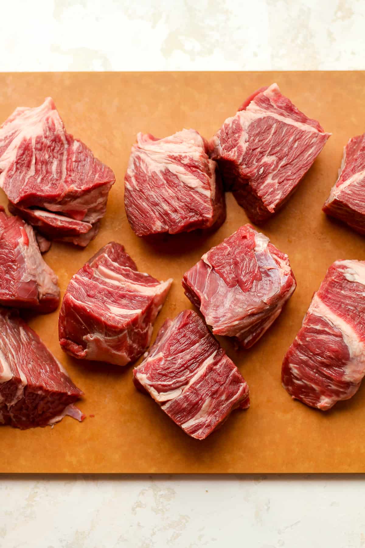 Cubes of beef roast on a cutting board