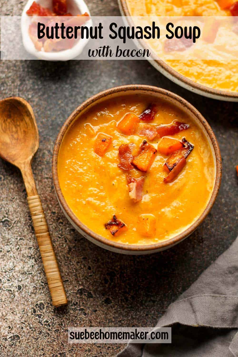 A bowl of butternut squash soup with bacon.