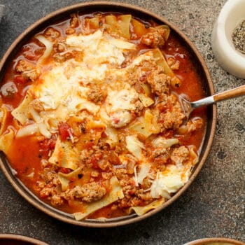 A closeup of a bowl of lasagna soup with ground turkey and cheese.