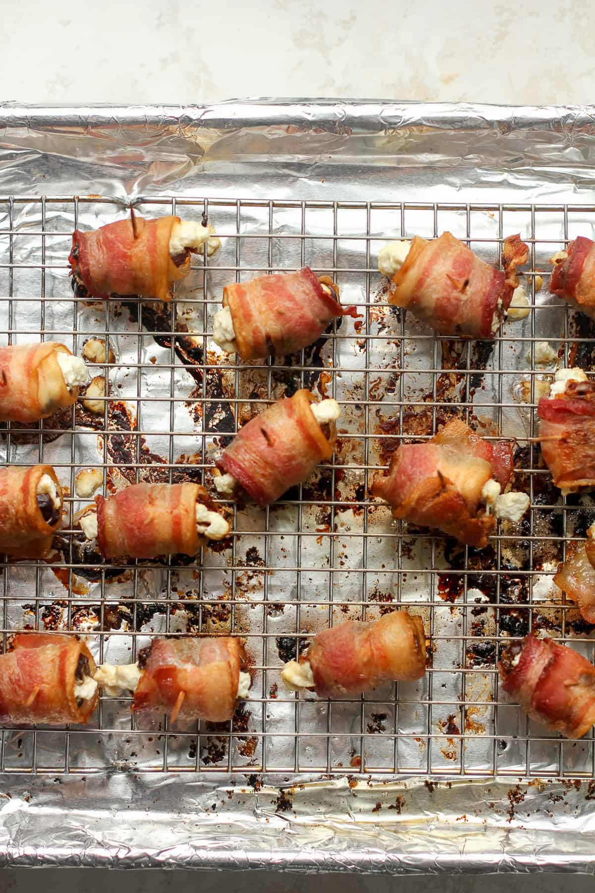 A pan of bacon wrapped dates.