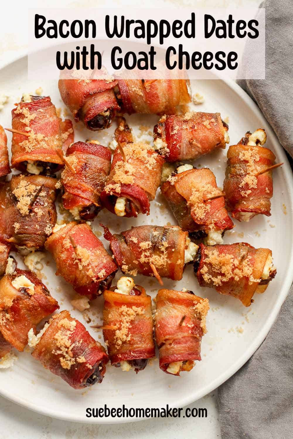 A plate of bacon wrapped dates with goat cheese, with a sprinkle of brown sugar.