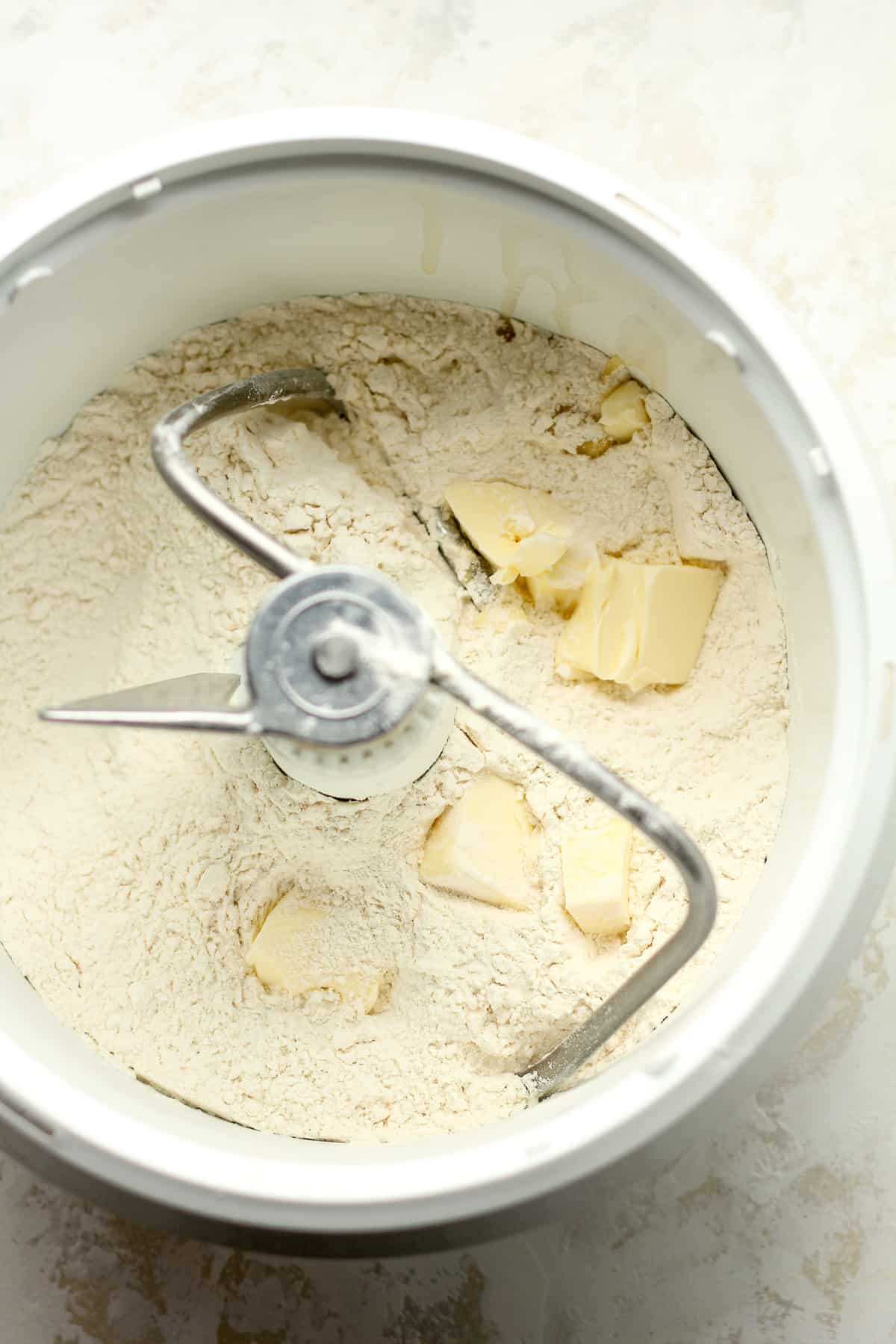 The mixer with flour plus butter.