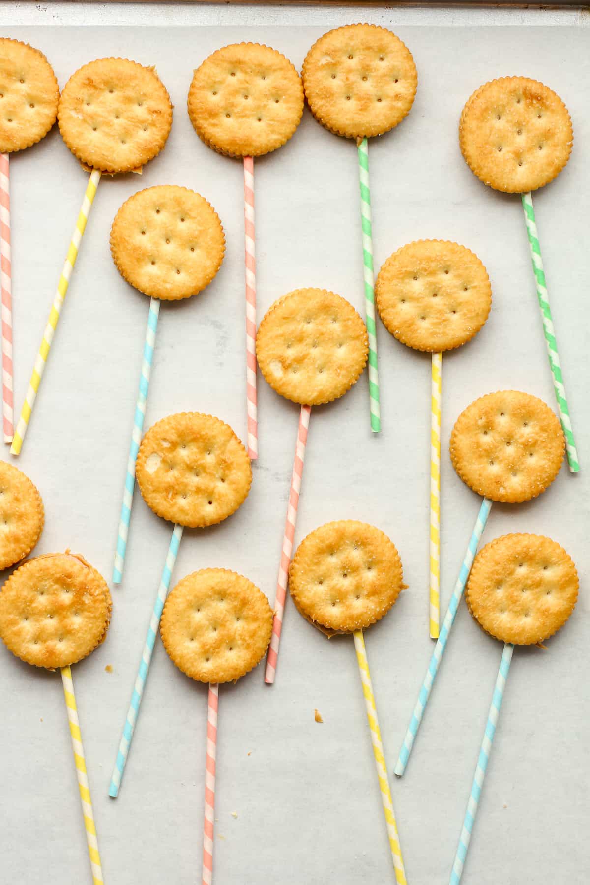 The peanut butter filled ritz crackers with lollipop sticks.