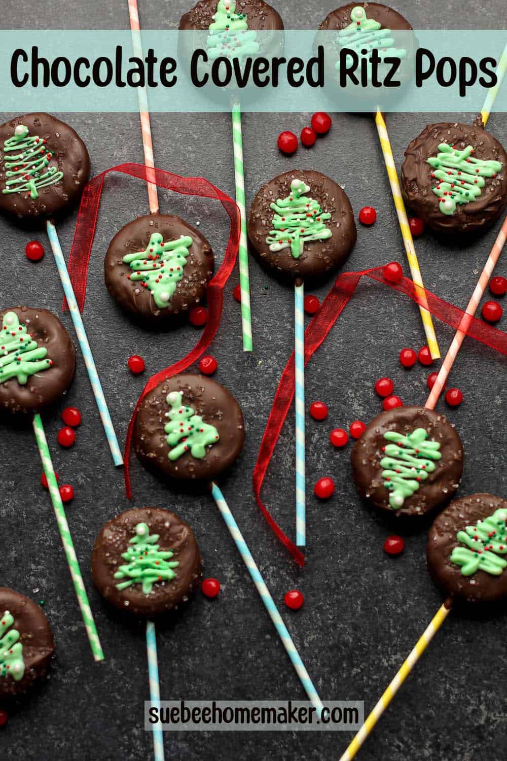 A dark background with chocolate covered ritz pops.