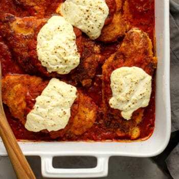 Closeup shot of some chicken parm with ricotta cheese.