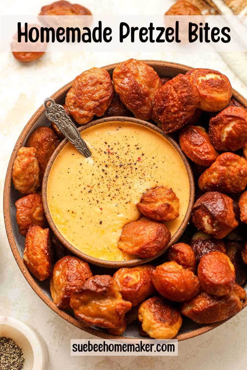 A bowl of homemade pretzel bites with a small bowl of cheese dip.