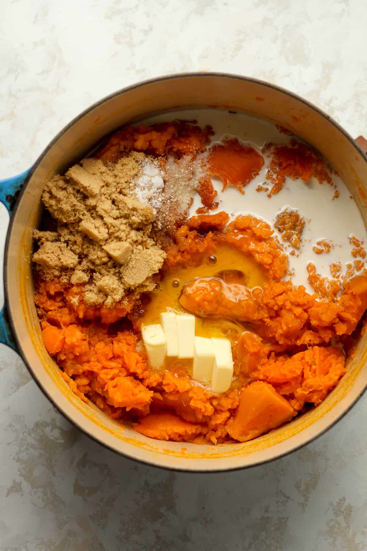 A pot of the mashed sweet potatoes with the toppings added in.