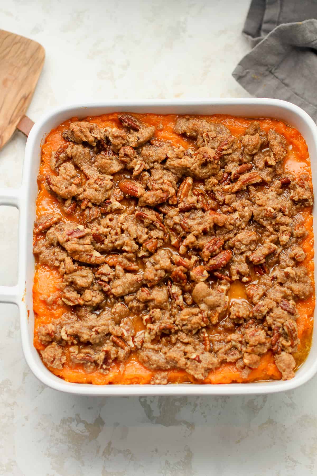 A square dish with a sweet potato and brown sugar crumble.