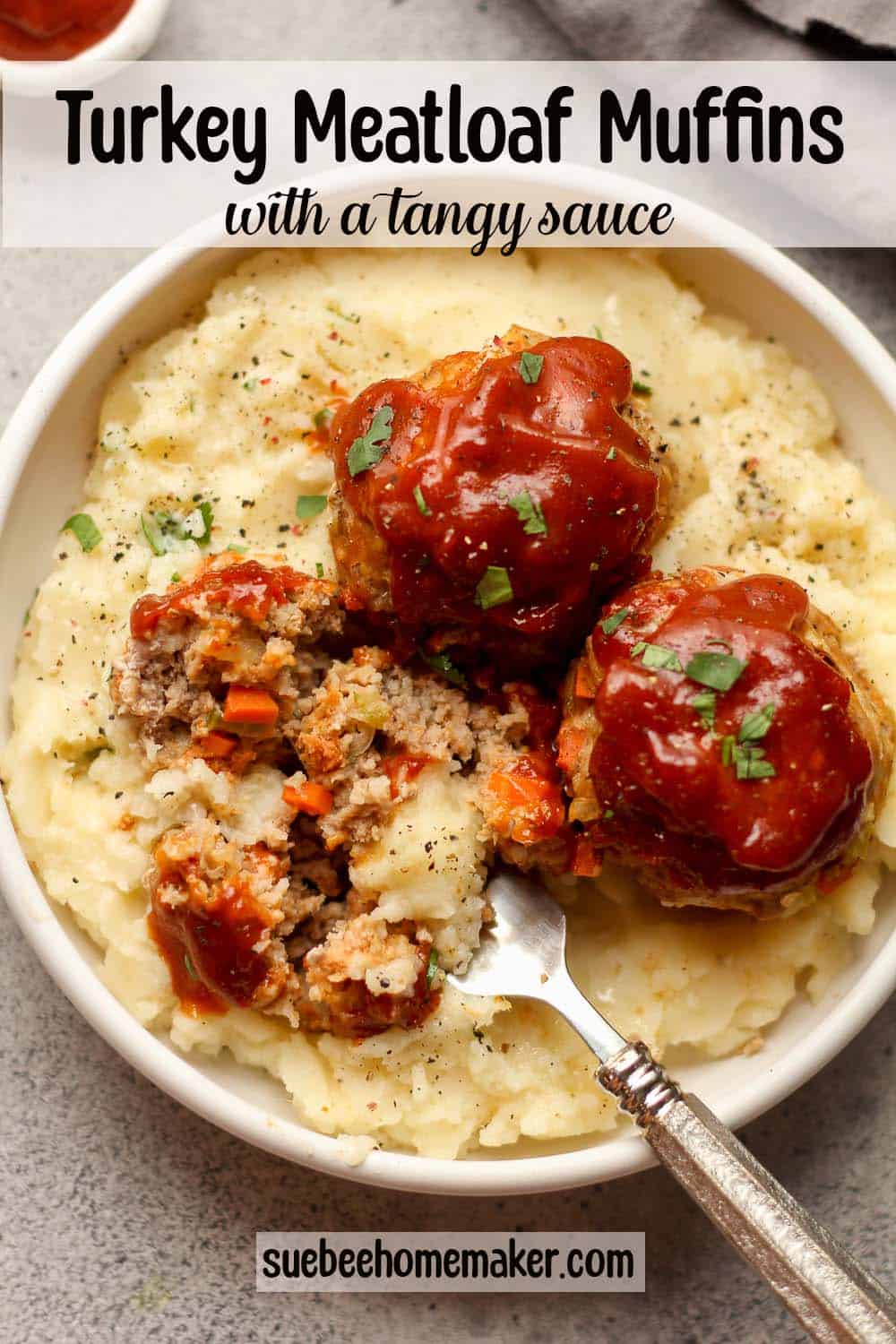 Some turkey meatloaf muffins with a tangy sauce over mashed potatoes.