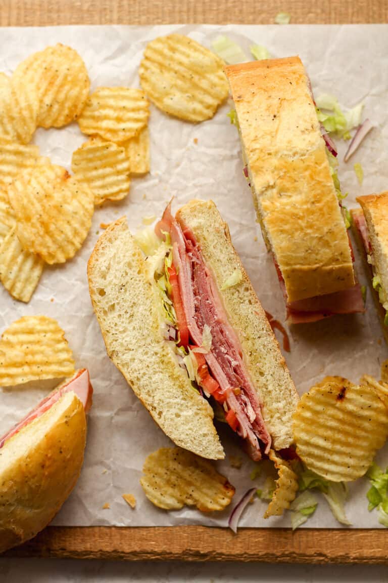 Overhead view of some sliced Italian grinders, showing the insides.