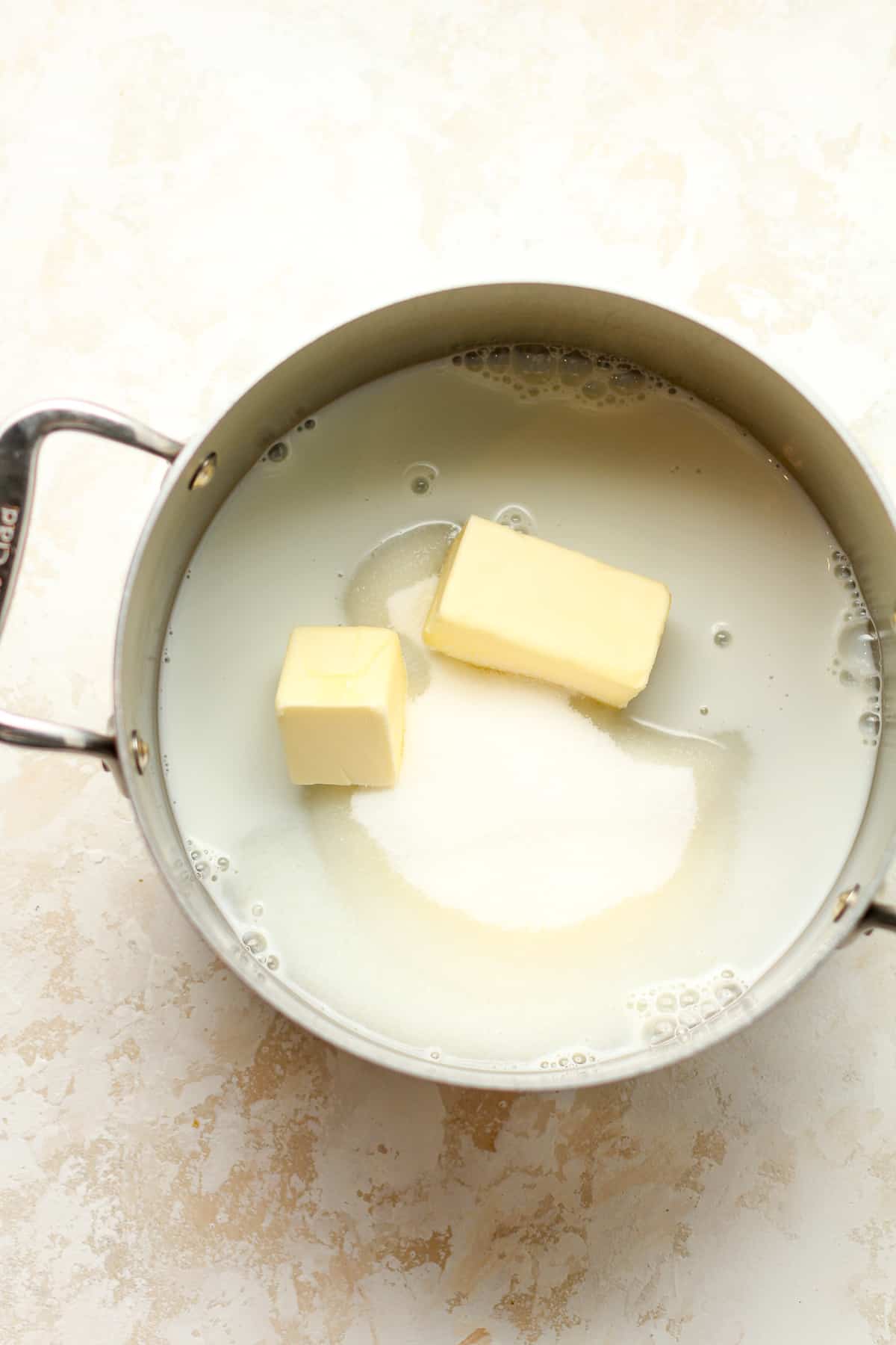 A pan of the milk, butter, and sugar.